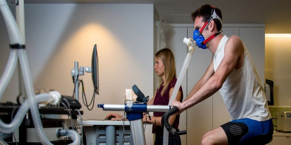 NZDF member on a cycling machine with oxygen monitoring equipment on