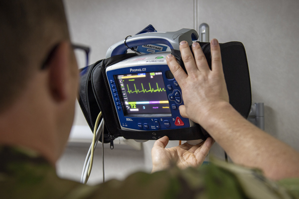 NZDF member looking at cardiac rehabilitation equipment