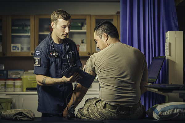 Doctor taking an NZDF member's blood pressure